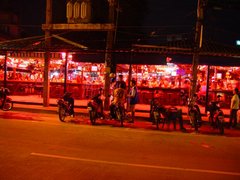 Open-air beer bars on Beach Road